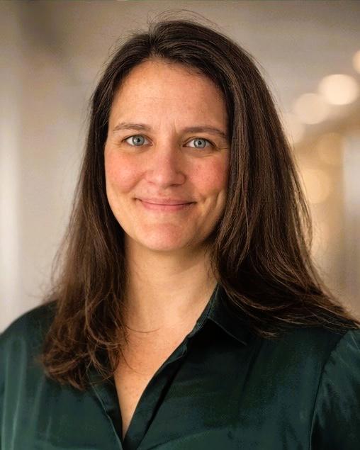 smiling woman in green shirt