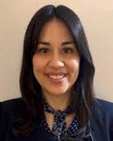 photo of Alejandra in black jacket with scarf around neck