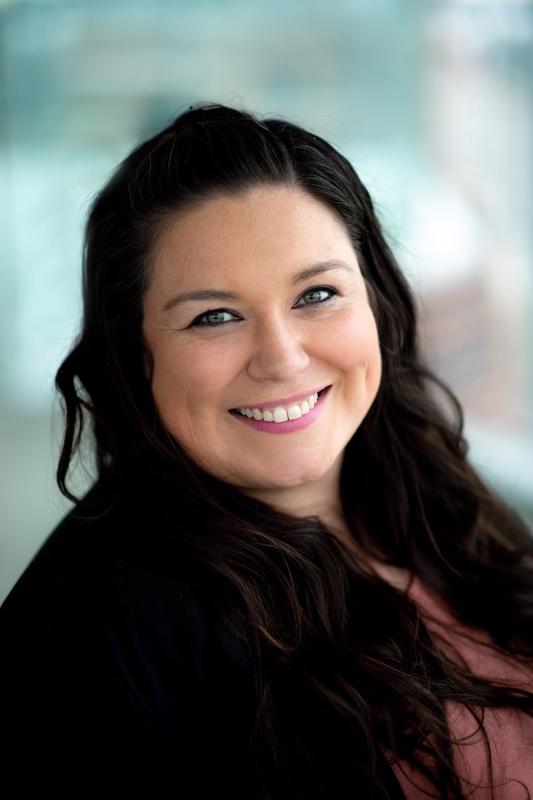 photo of smiling Brittany Martinez looking into camera