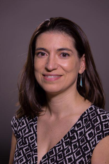 smiling woman wearing black and white top