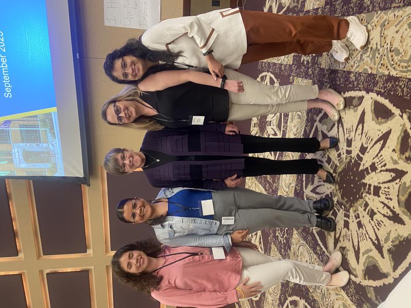 five women posing for a photo