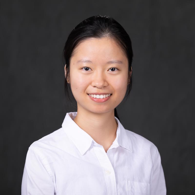 smiling woman in white shirt