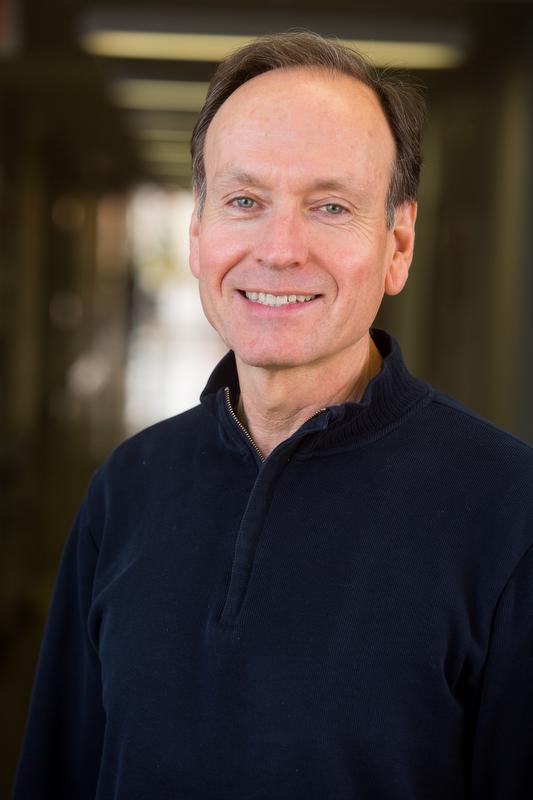 smiling man in black shirt