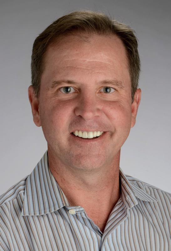 smiling man  in striped shirt