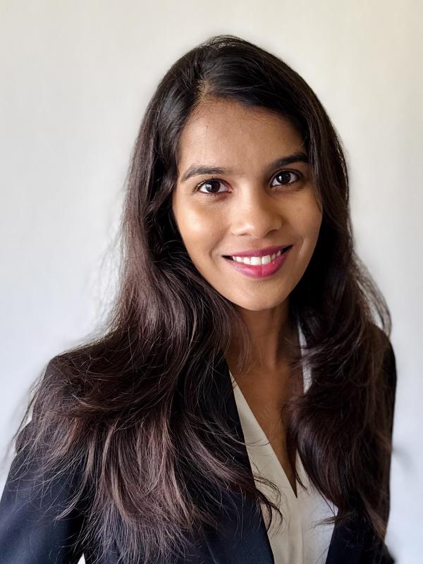 smiling woman wearing black jacket and white shirt